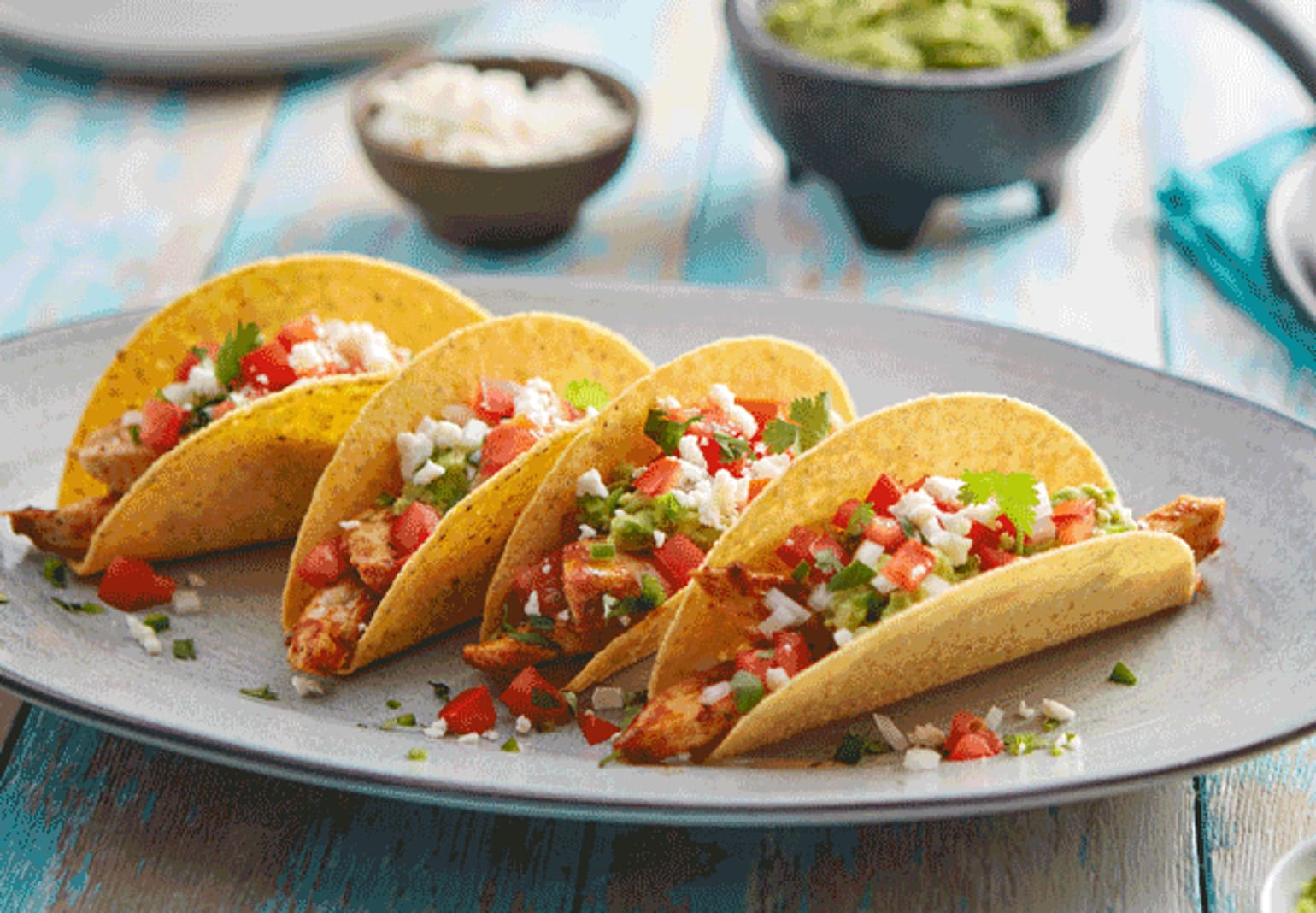 CHICKEN AND LAYERED GUACAMOLE BLUE CORN TACOS